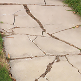 some recommended spring outdoor home maintenance includes fixing cracked and broken sidewalks
