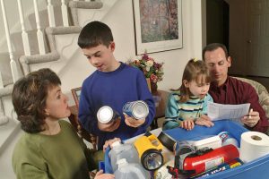 A family builds an emergency kit to prepare for severe weather